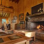 Lobby Great Room has Southern Pine Paneling, wood burning fireplace, business center, leather sofas.