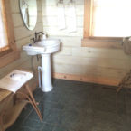 #446 King Suite - Guest vanity with large, blue limestone slate step-in shower.