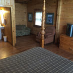 446 Log Cabin Queen Suite with sleeper sofa, and private bath.