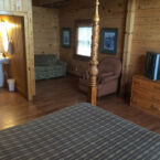 446 Log Cabin Queen Suite with sleeper sofa, and private bath.