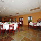 Banquet and Meeting space in the Smoke House Conference Center surrounded by Southern Pine wall panneling and Blue Limestone Slate floors.