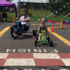Big Wheels for adults, and pedal cars for children complete with painted track for racing, cones, barrels, and games for all ages.