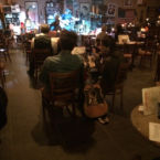 Coming up next. A singer songwriter waits his turn to perform on the Smoke House stage.