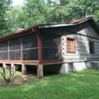 OUTSIDE FRONT of Log Cabin 426, a two bed room. lg living, and front porch, jetted garden tub.