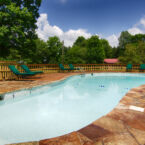 Outdoor Swimming Pool looking toward the cabins and grounds.