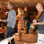 The Henningsens behind the stage.