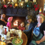 The Pahanish family enjoy a Holiday picture with Betsy Oliver.