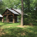 Timber Frame Cabins surrounded by hemlocks.