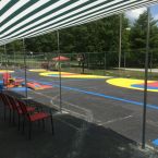 Two play courts offer 3 basketball courts, corn bag games, big wheel trike and padal car racing track.